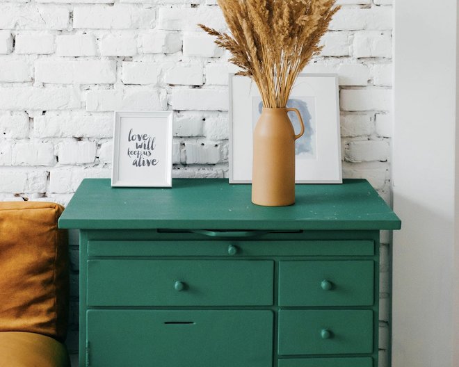 beautiful drawer with flower pot and decoration on it